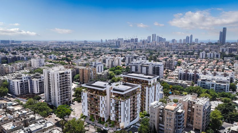 Vue aerienne du programme neuf Bialik a Holon avec la skyline de Tel Aviv et la mer en arriere-plan